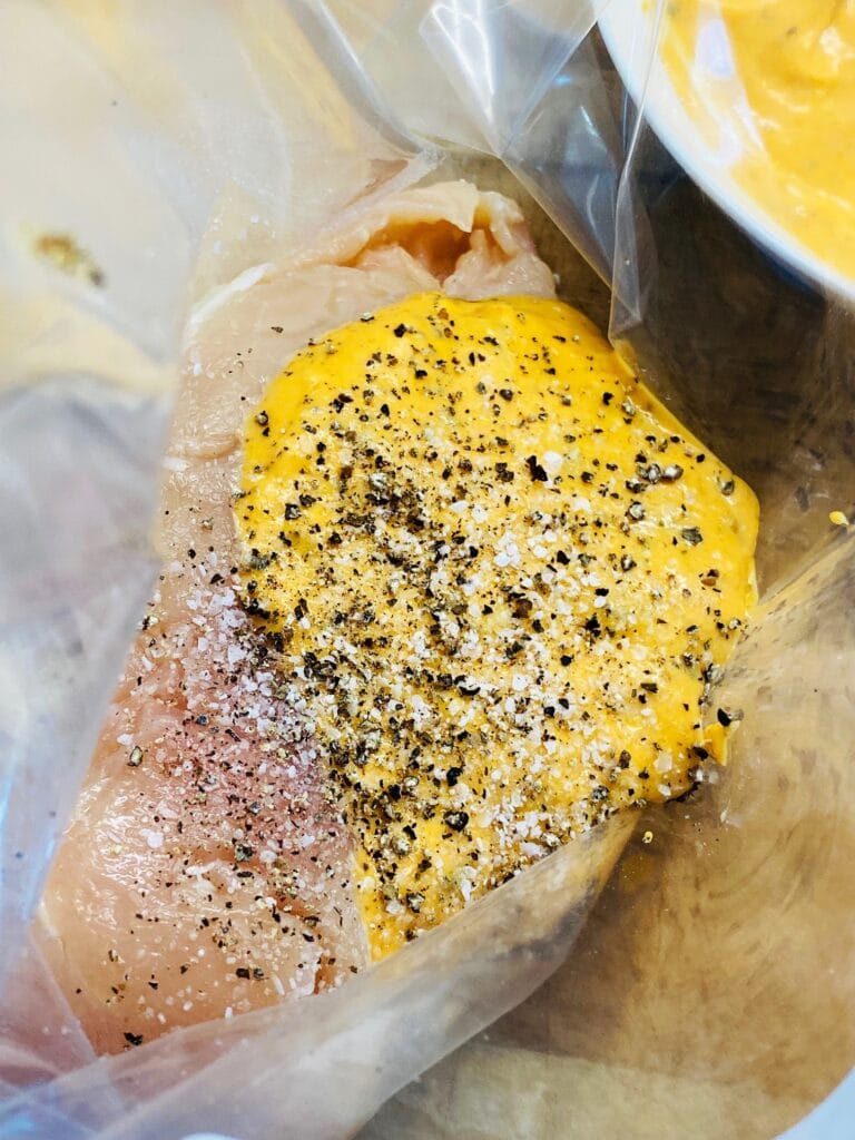 chicken marinating in a bag