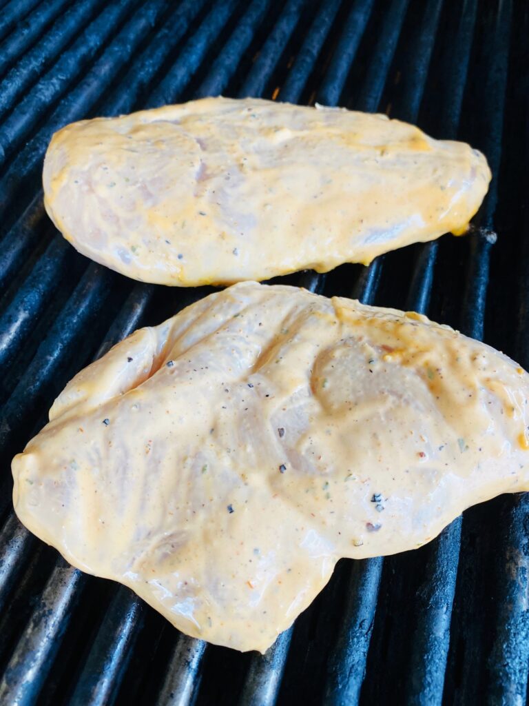 chicken on the grill before cooking