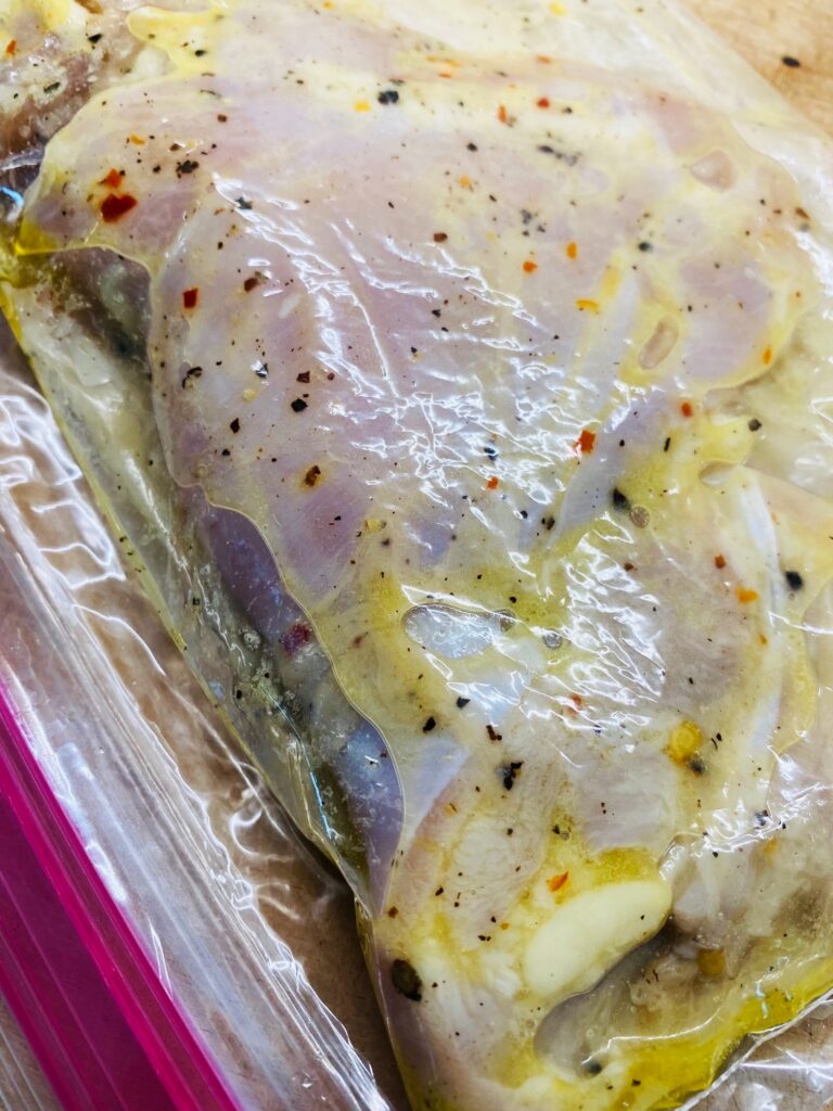 chicken marinating in a bag for grilled citrus marinated chicken