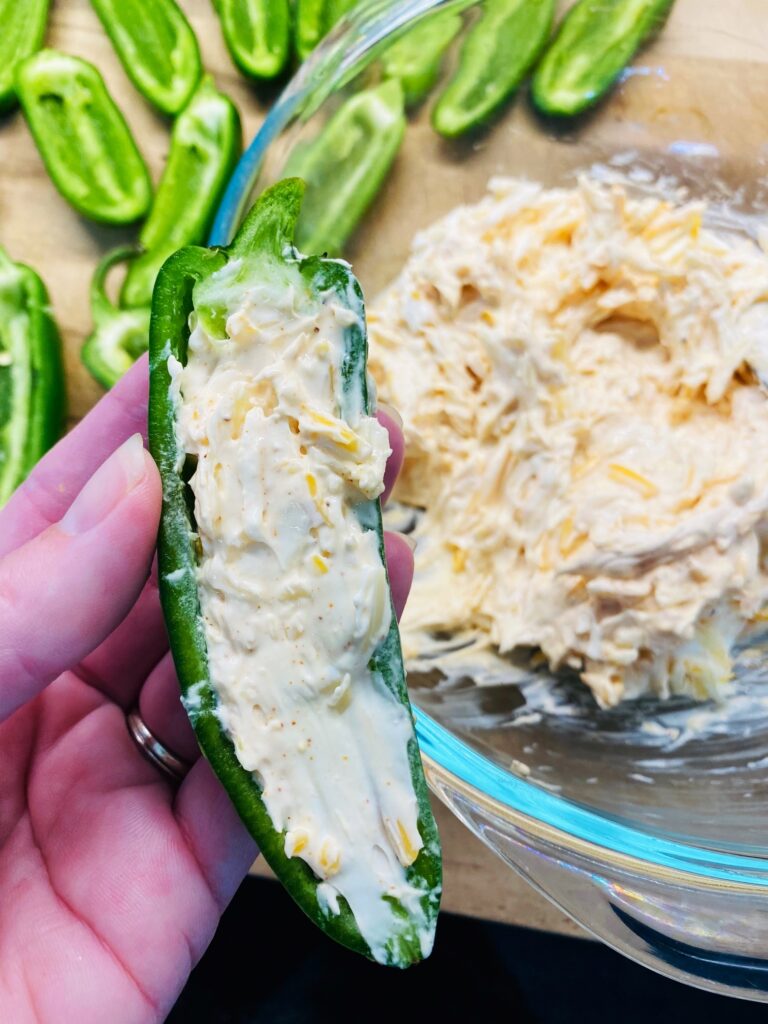 cheese filling in a halved jalapeno