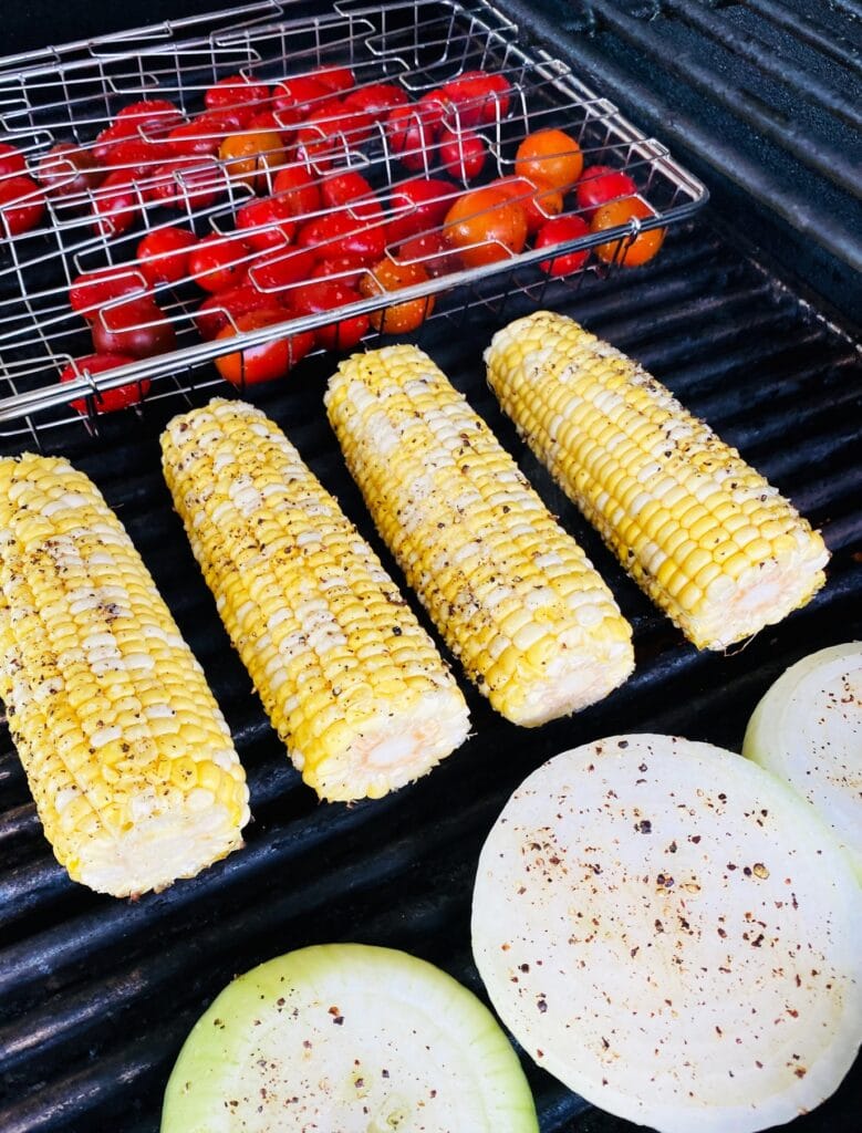 tomatoes corn and onion on the grill