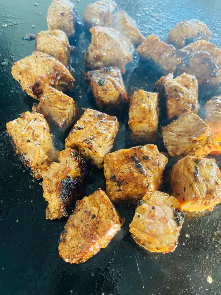 steak cubes after cooking on the griddle