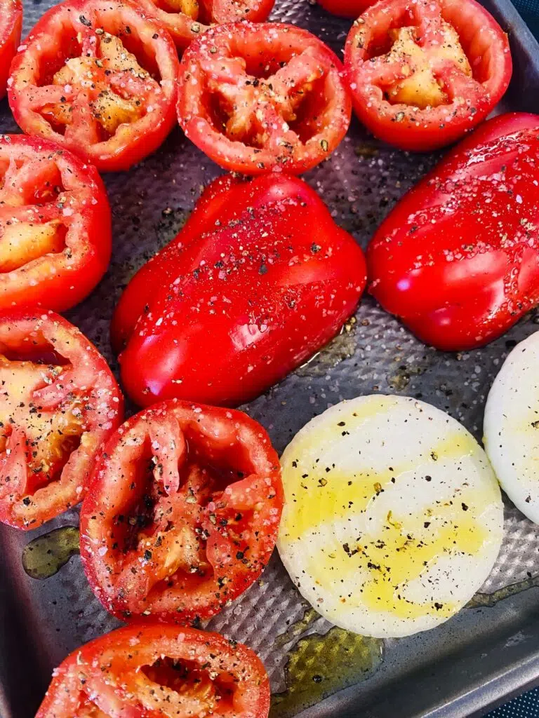 tomatos pepper and onion slices drizzled with olive oil salt and pepper