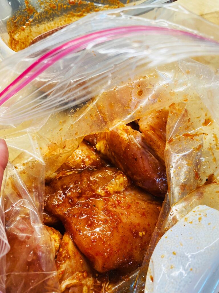 chicken marinating in a bag