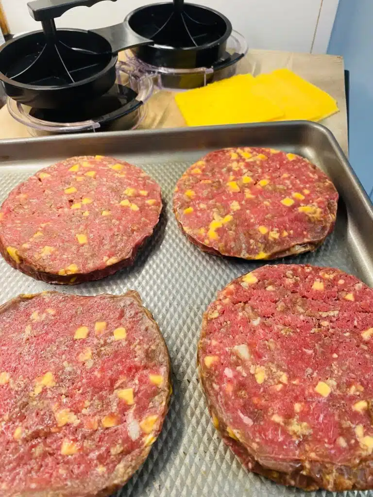 Making the burger patties with a burger press