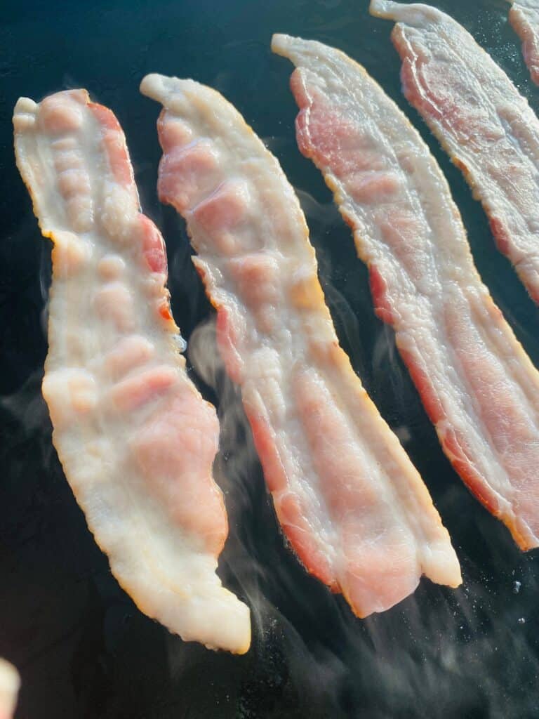 Bacon on the griddle before cooking