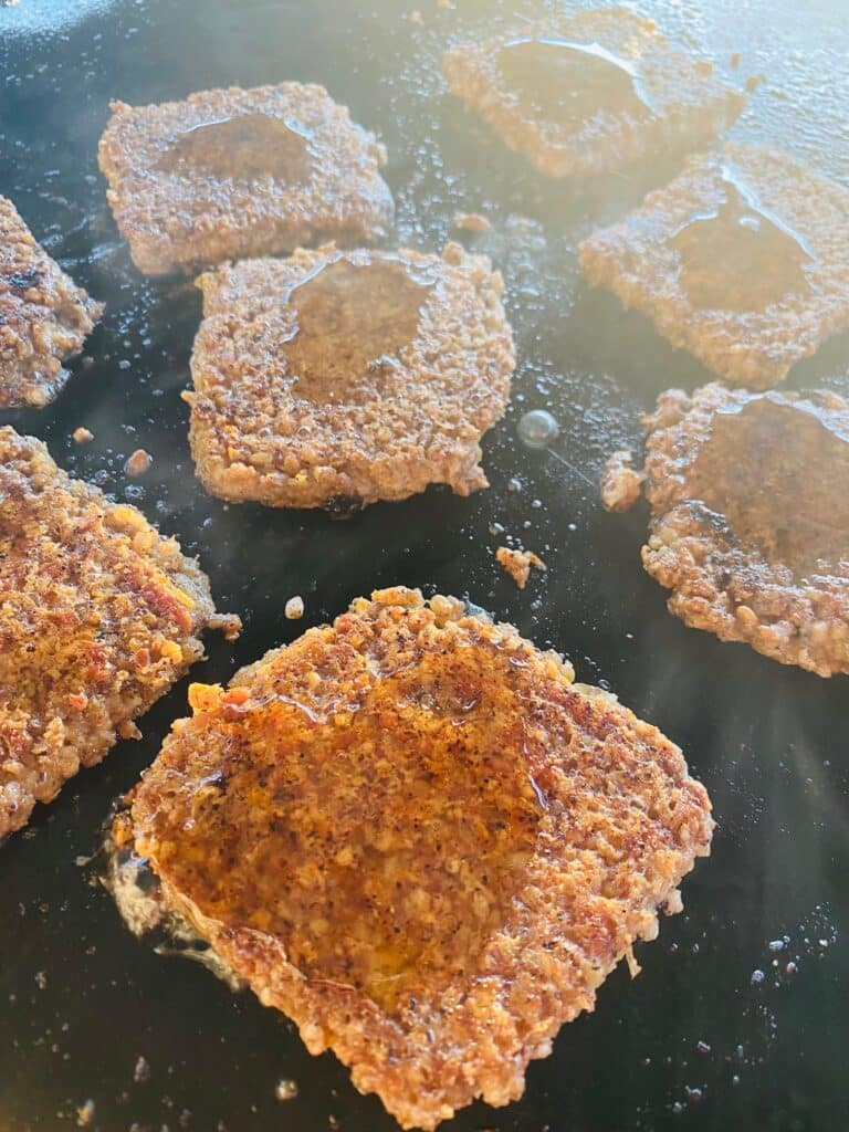 Adding Maple syrup and hot sauce to Blackstone Goetta Bacon Sliders