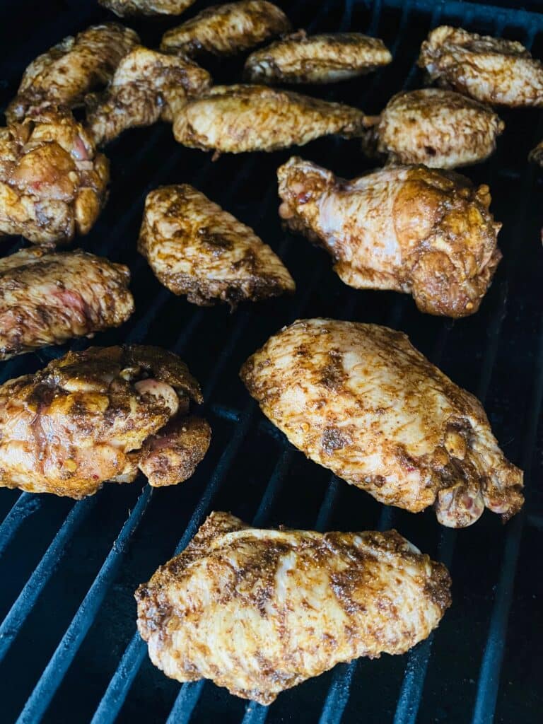 Chicken wings on the smoker before cooking