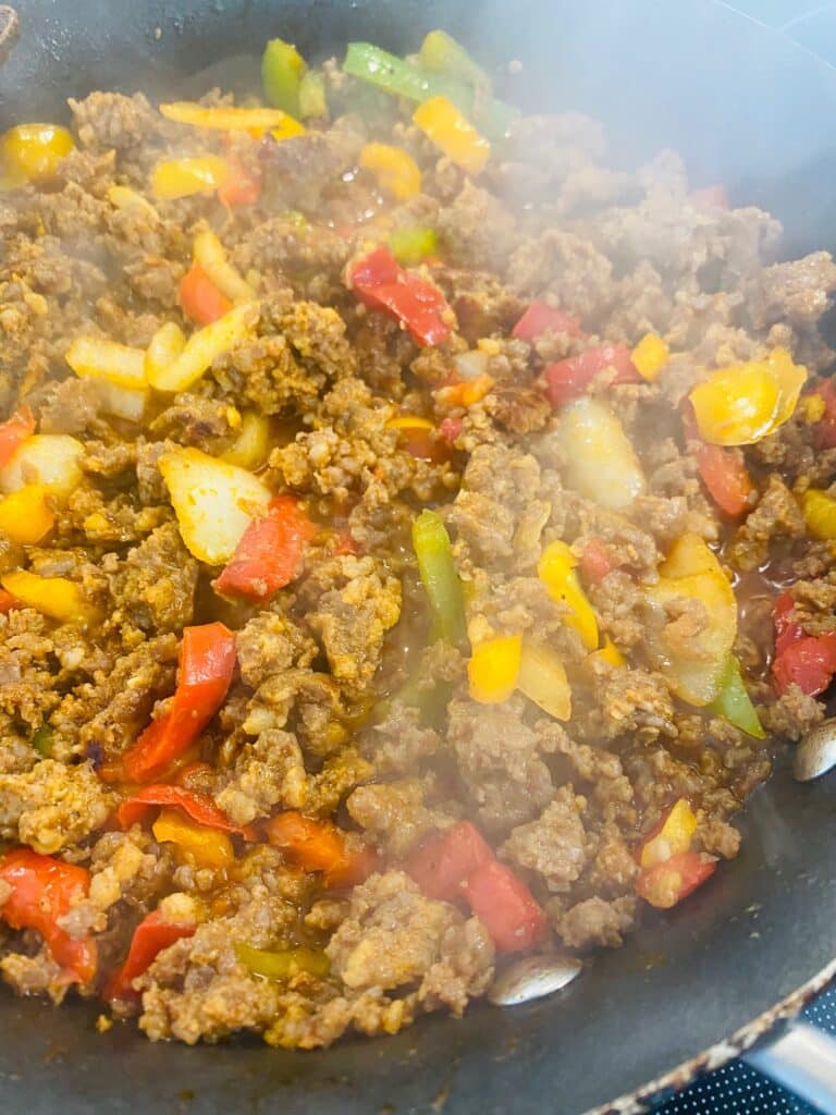 cooked sausage with peppers and onions