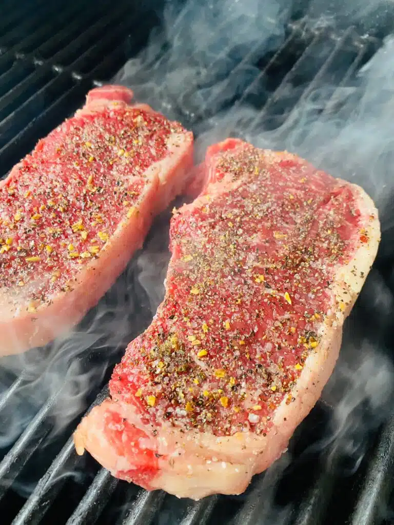 seasoned Steaks on the grill