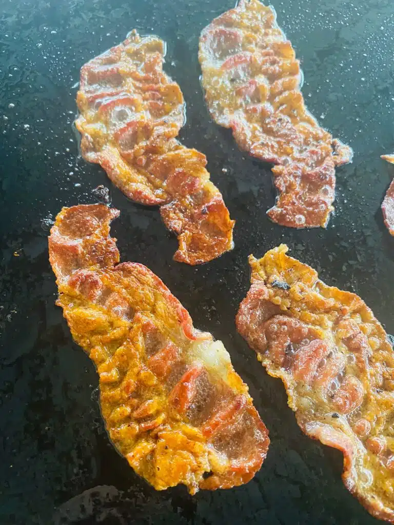 bacon cooking on the Griddle