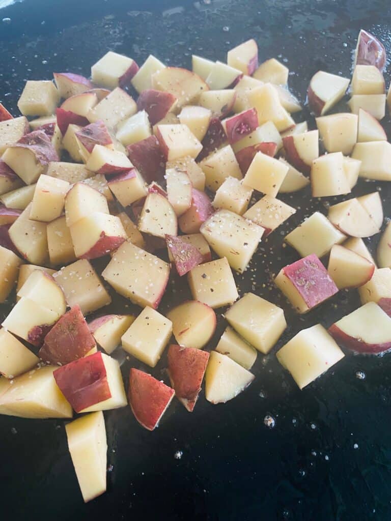 potatoes on the griddle before cooking