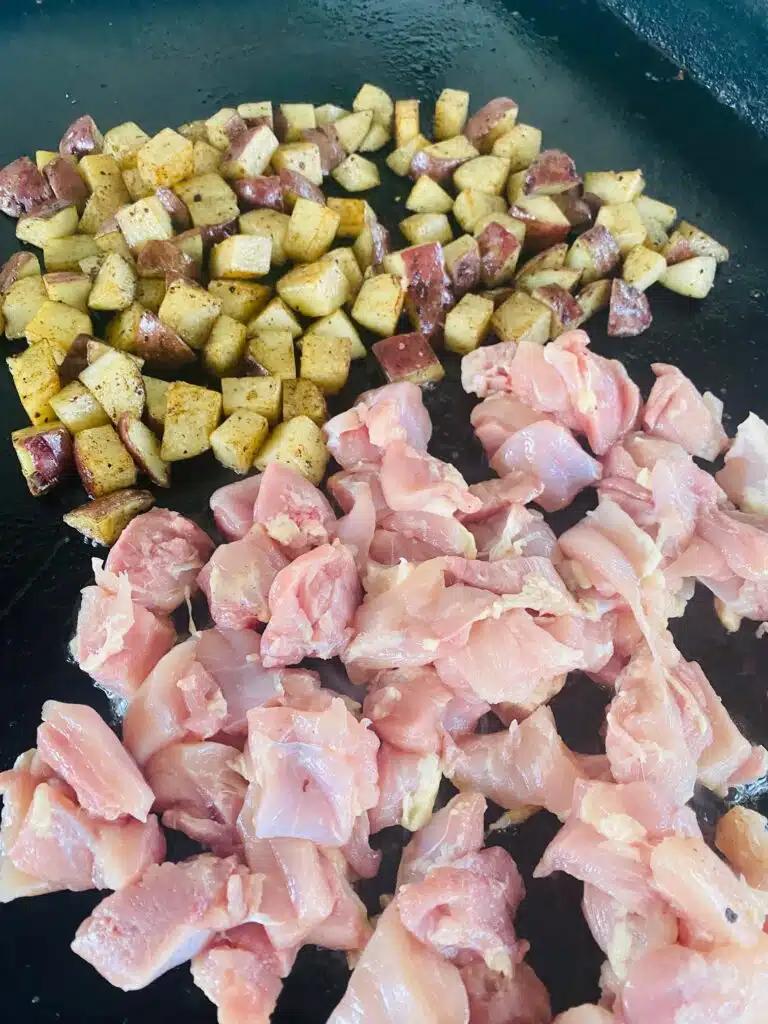 diced potatoes and chicken on the Griddle before cooking