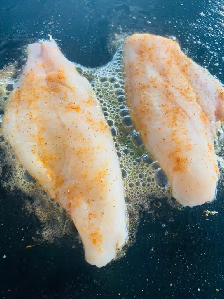 catfish on the griddle before cooking
