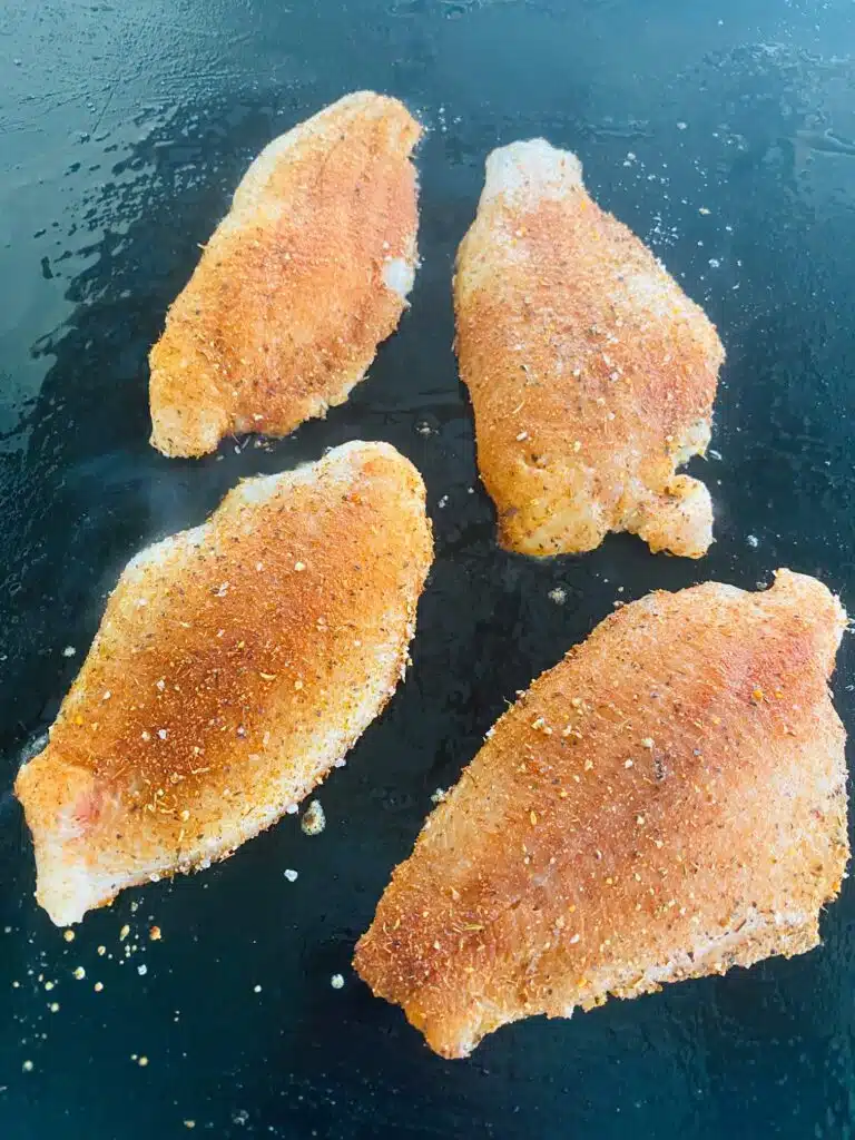 Catfish filets on the Griddle before cooking