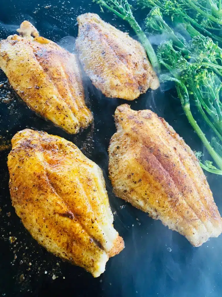 catfish cooking on the Griddle with broccolini
