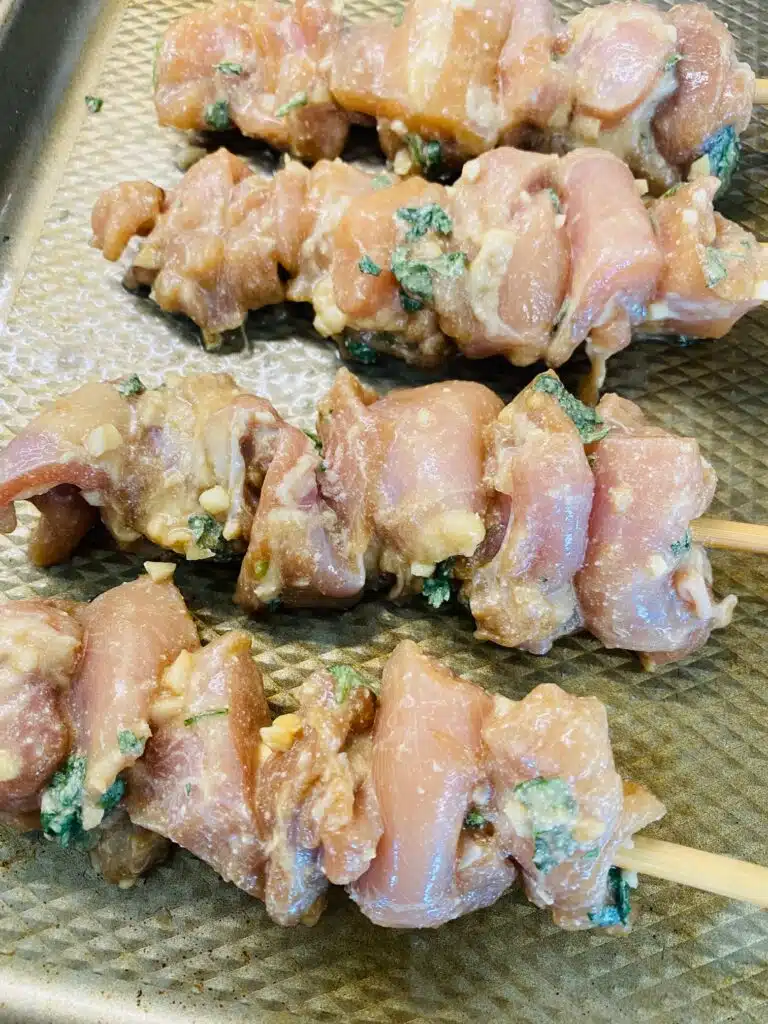 chicken on skewers before grilling