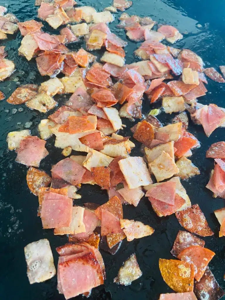 chopped Italian meat on the griddle