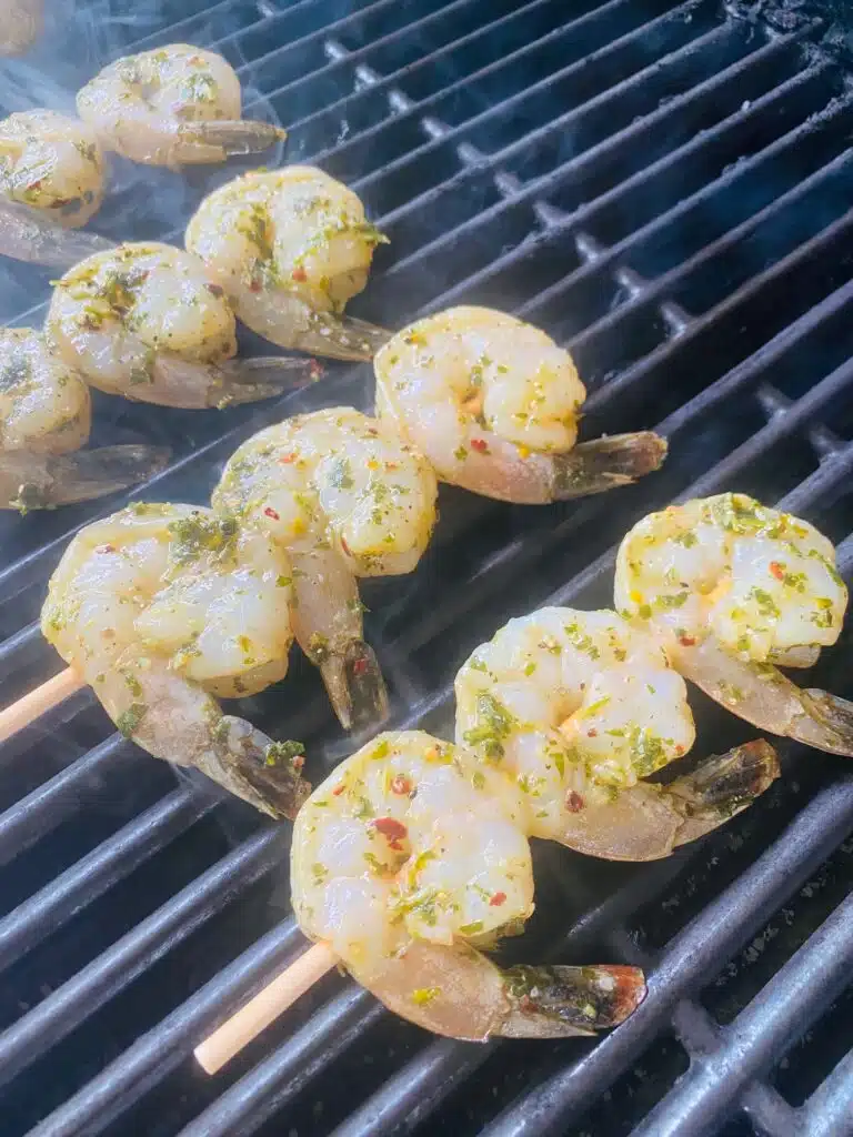 shrimp kabobs on the grill before cooking