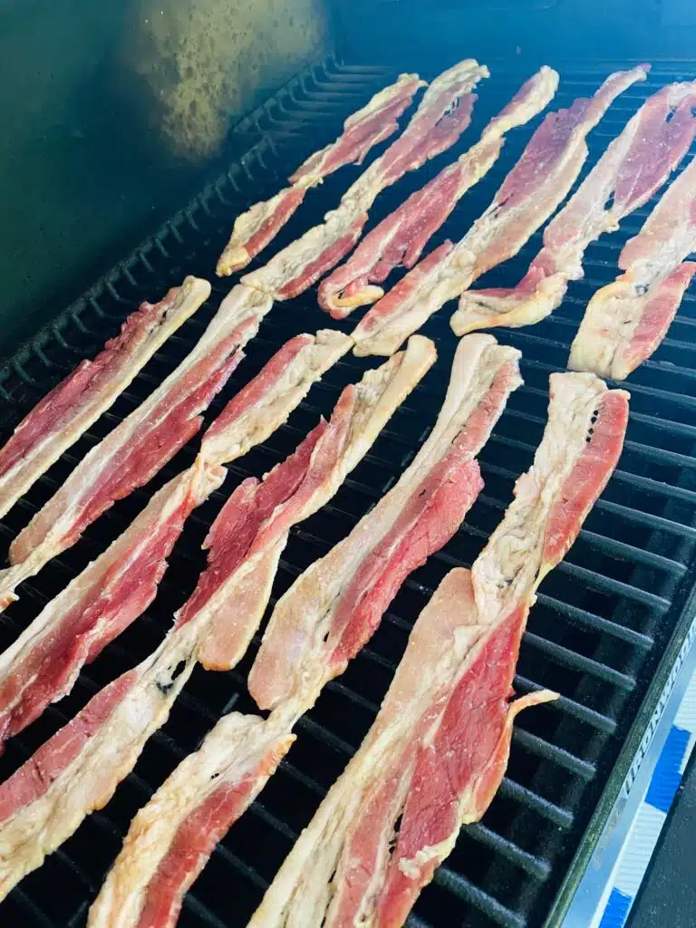 bacon on the smoker before cooking