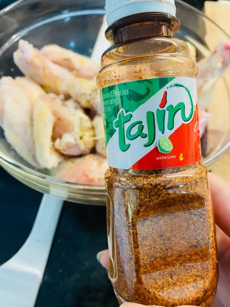 seasoning chicken wings with Tajin