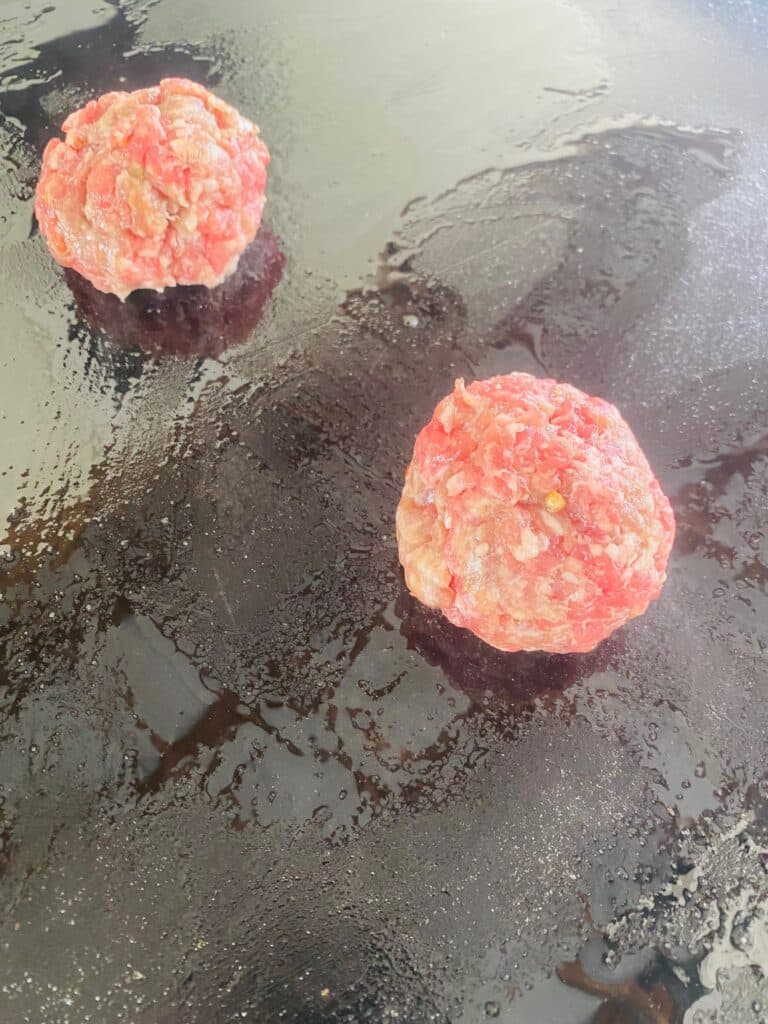 add the sausage to the hot griddle