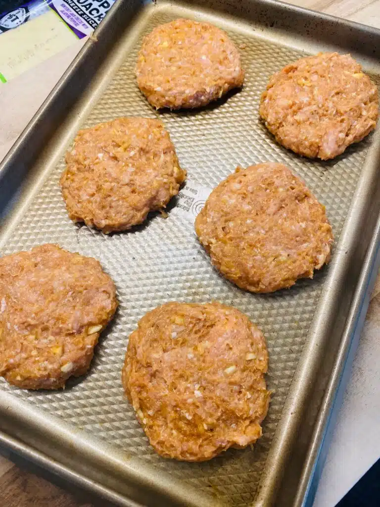 slider patties on a tray before cooking