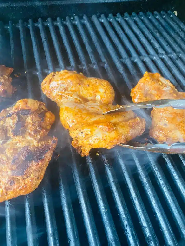flipping Grilled Taco Chicken Thighs