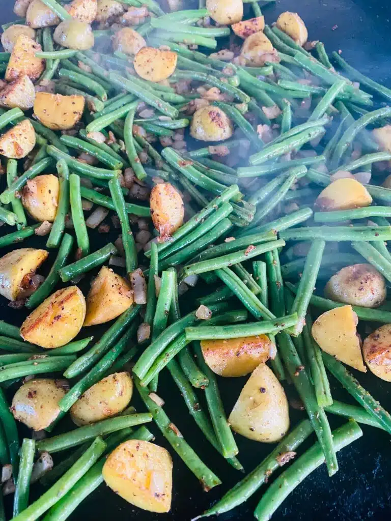 potatoes and green beans halfway through cooking