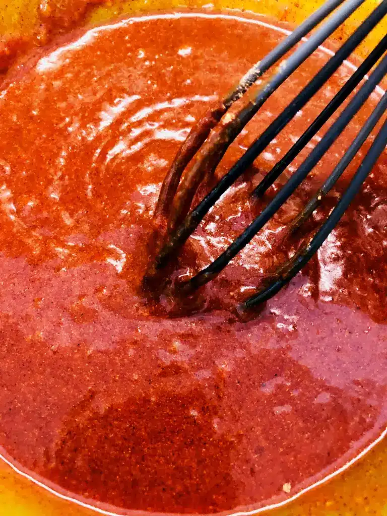 mixing the sauce for the wings