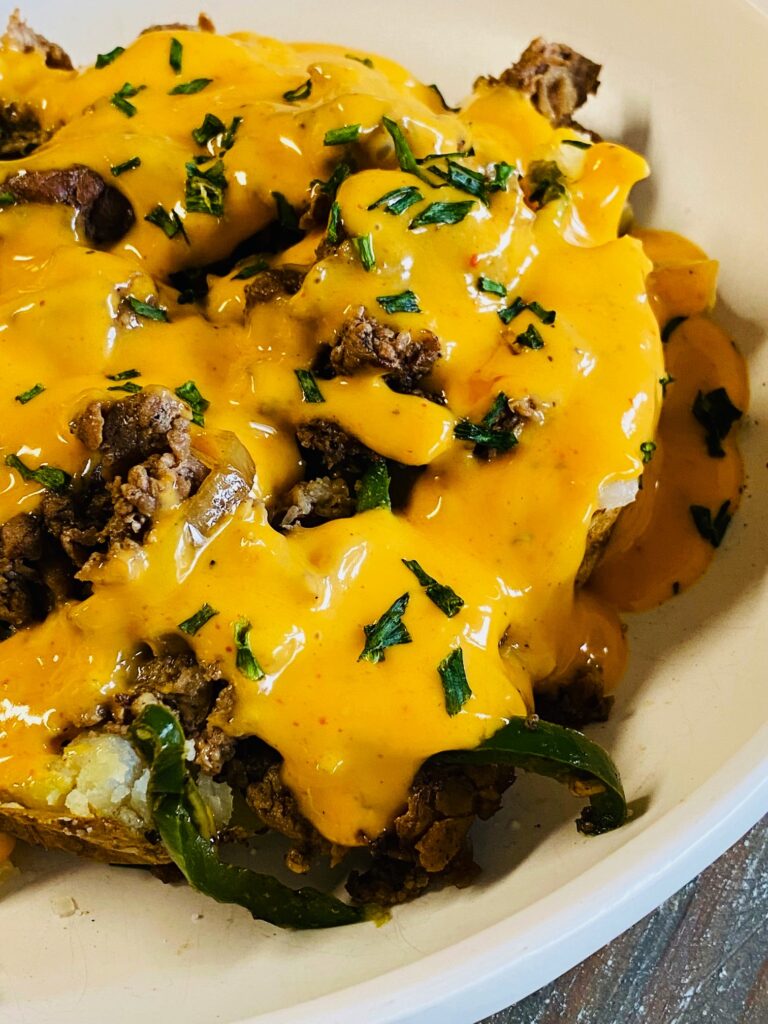 Blackstone Cheesesteak Loaded Potatoes
