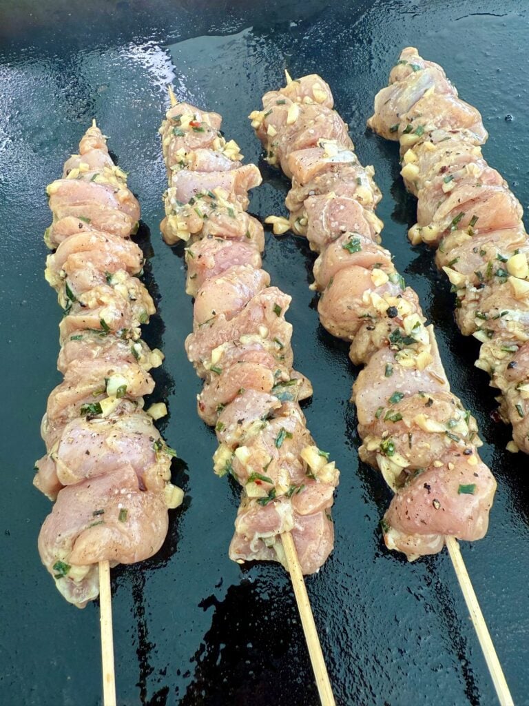 kabobs on griddle before cooking