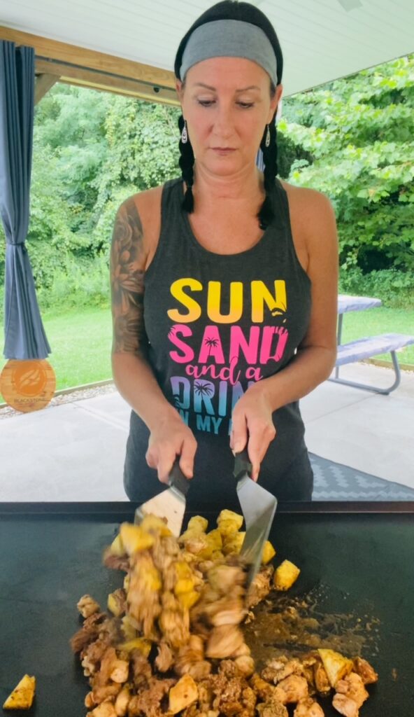 mixing the chicken with spatulas