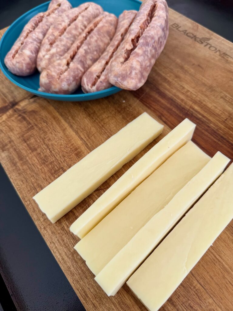 sliced cheese and sausages