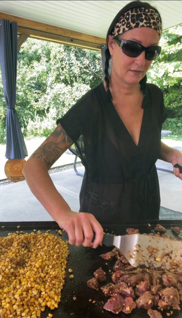 adding steak to the griddle