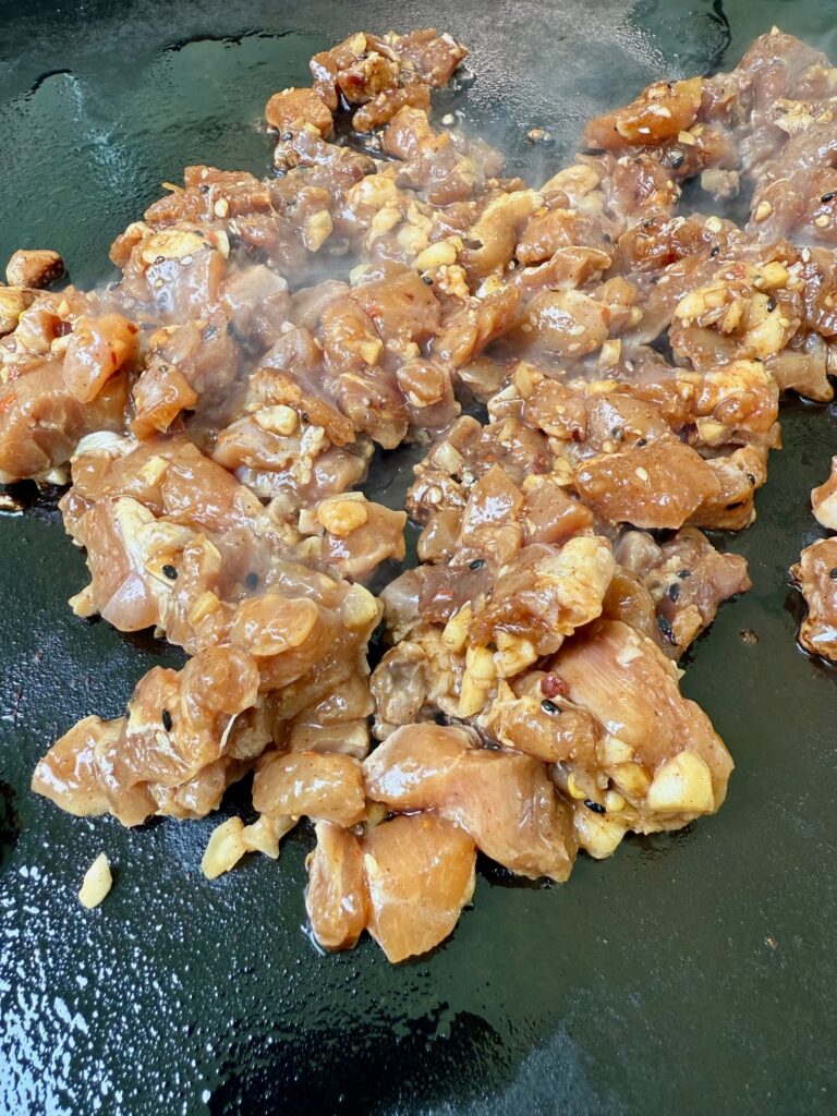 cooking the chicken on the griddle