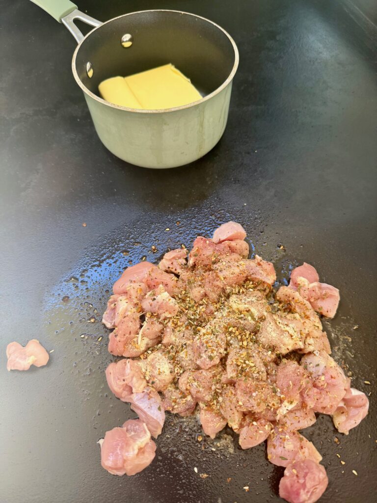 chicken starting to cook on the griddle