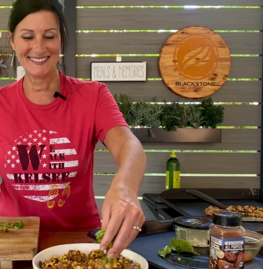 adding basil and feta to Blackstone Chicken Zucchini and Corn