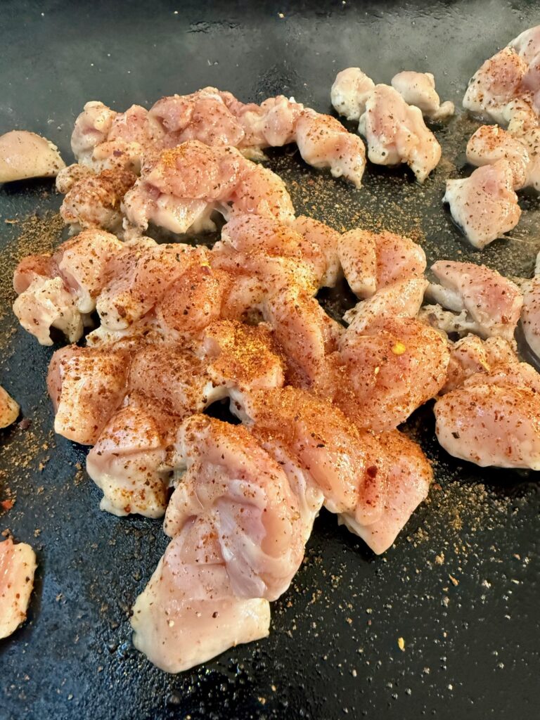 chicken cooking on the griddle