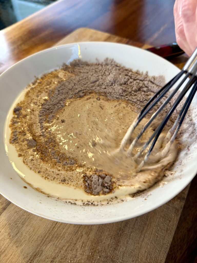 mixing the sauce in a bowl for Blackstone Beef Stew Stir Fry