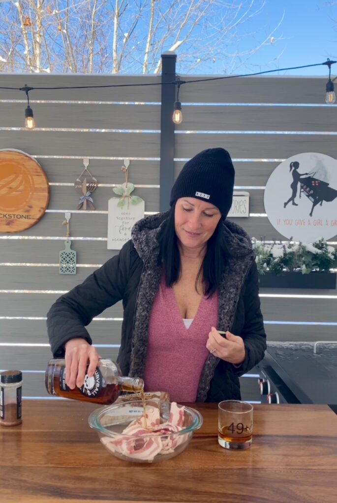 adding whiskey to the bacon