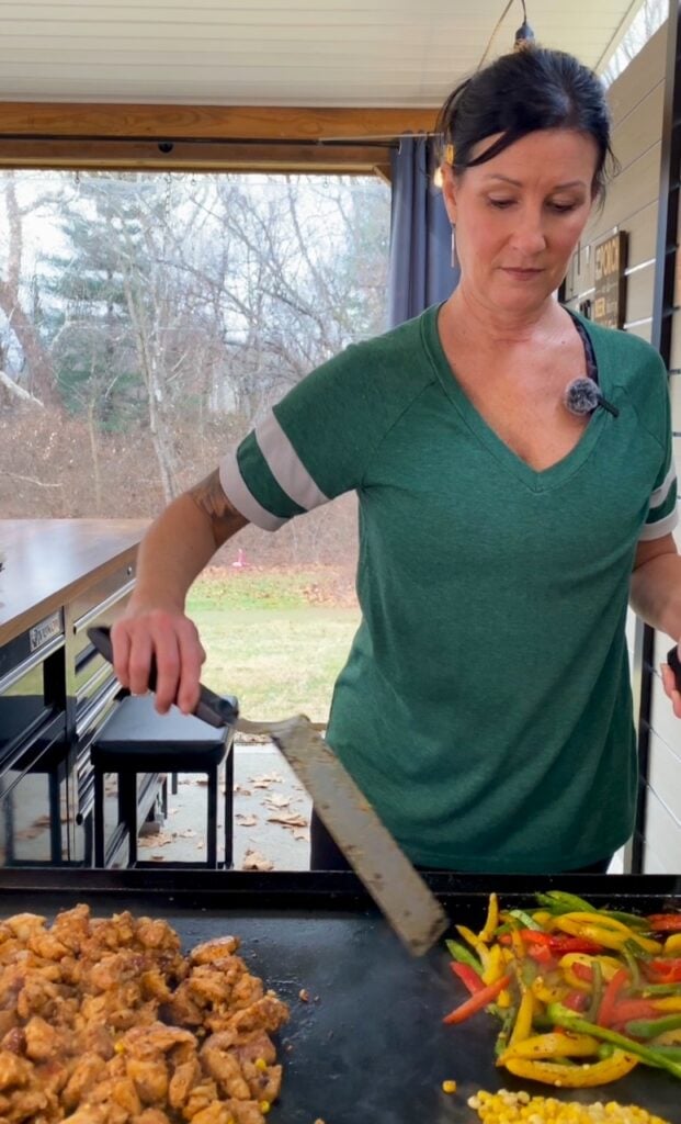 cooking chicken and veggies on griddle