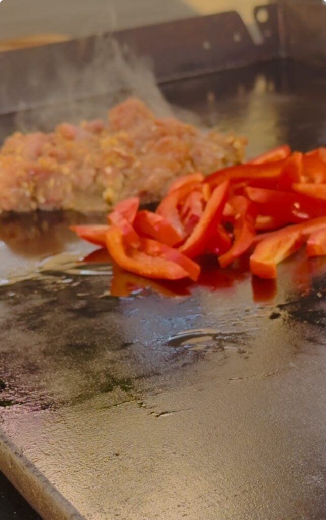 cooking the chicken and peppers