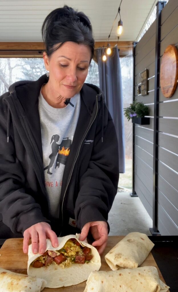 rolling the Blackstone Sausage Jalapeno Breakfast Burritos