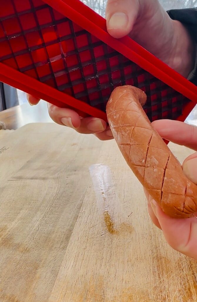 using the slotdog to criss cross the hot dogs