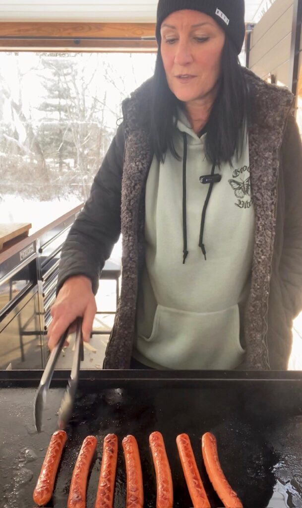 cooking the dogs on the griddle