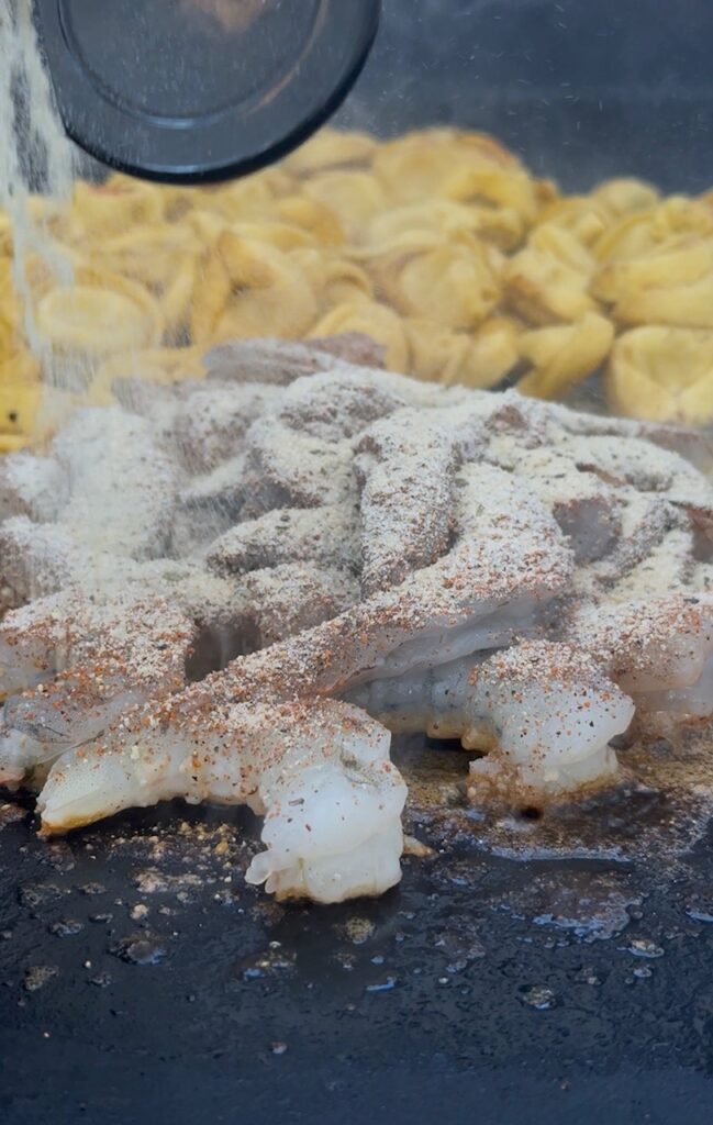 adding shrimp and seasonings