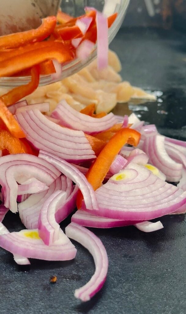 starting to cook the veggies on the griddle