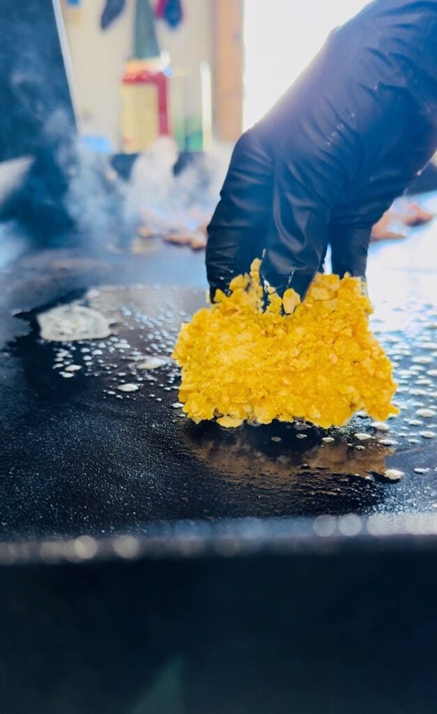 adding french toast to griddle