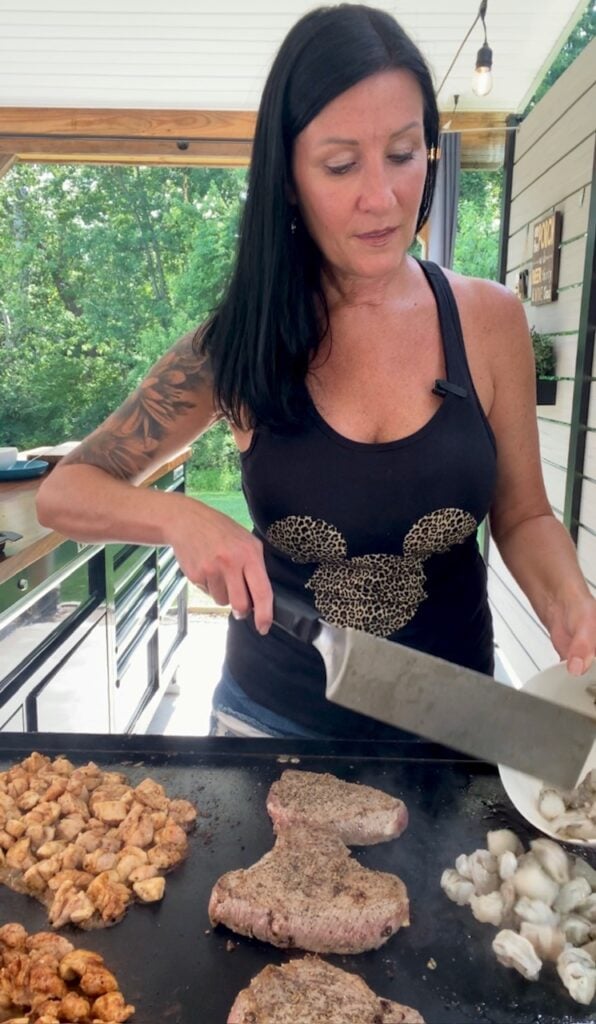 adding shrimp to the griddle